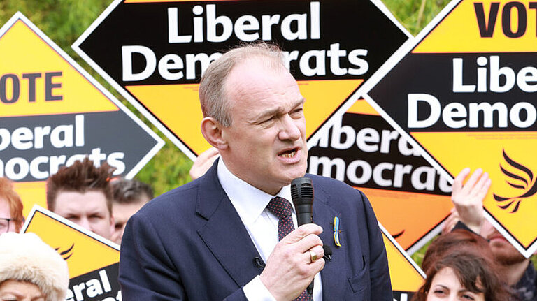 Ed Davey Ed Davey in front of a crowd holding Liberal Democrat posters