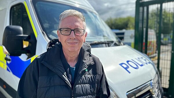 Brian with a police van